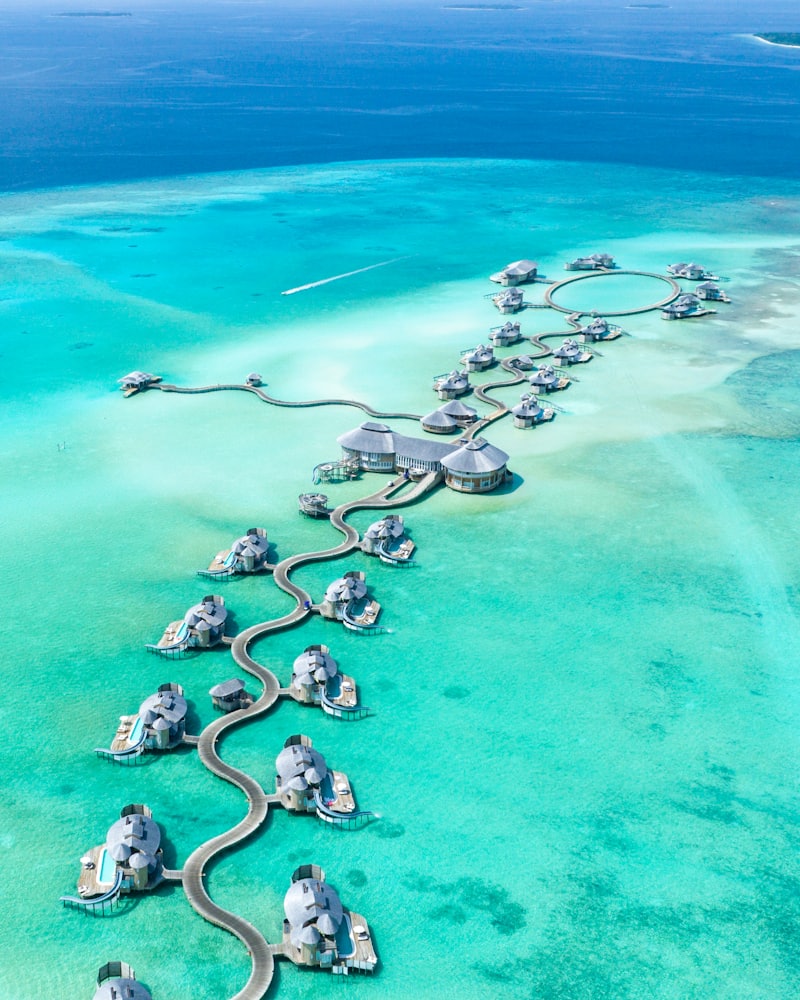 Aerial view of a yacht moored in a calm sheltered cove